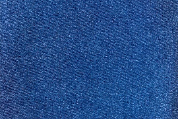 Photo detailed texture fabric denim background, blue jeans.