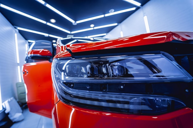 Photo detailing of clean and shining polished red car