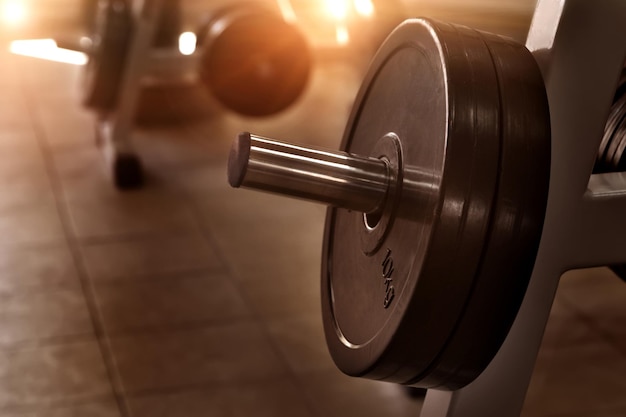 Photo details of barbell are in a gym