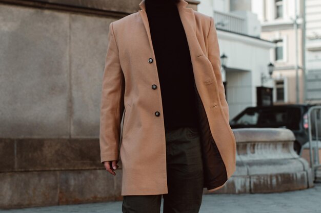 Photo details of beige brown mens coat pants and black turtleneck classic street outerwear