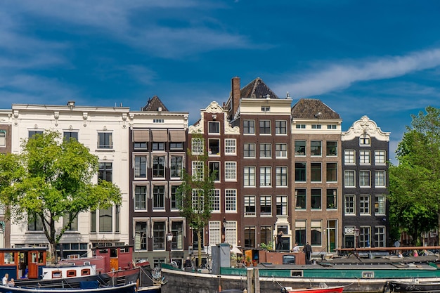 Details and facades of Amsterdam characteristic brick construction of residential building in Amsterdam School style High quality photo