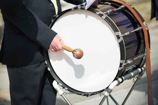 Photo details of hands playing the bass drum