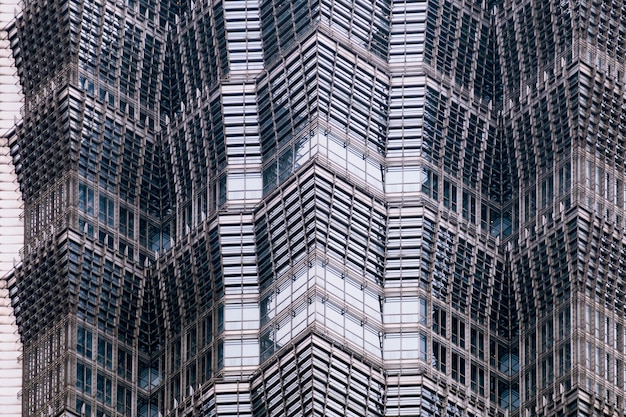 写真 ガラスと鋼のクローズアップで作られた近代的な高層ビルのファサードの詳細。