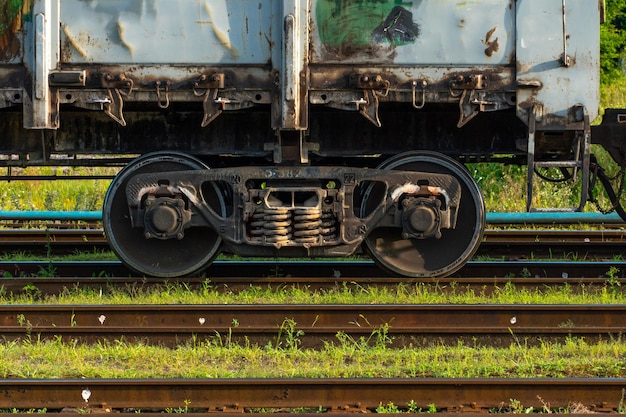 Details of the train in closeup railway locomotive wheels and\
springs repair train