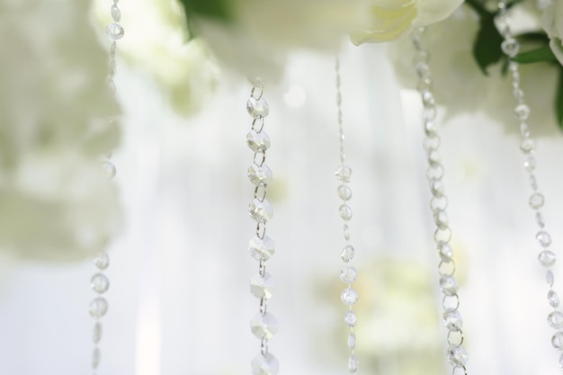 Details of the wedding ceremony made of fresh flowers sparkling beads