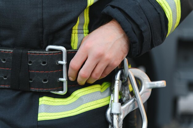 details with the carabiner and harness of a firefighter