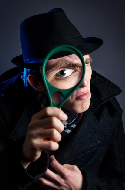 Detective with magnifier glass