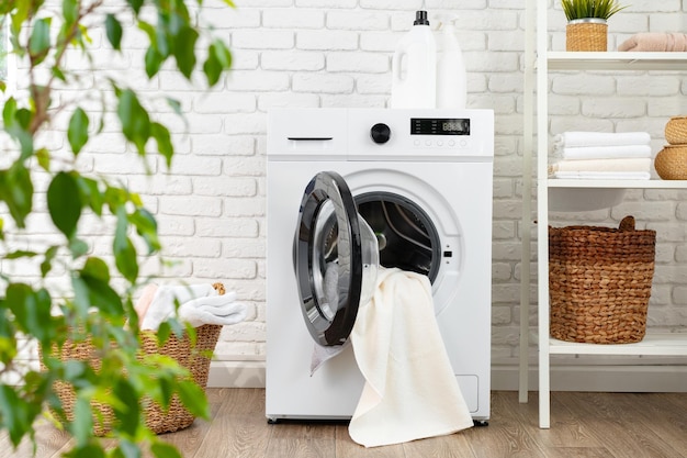 Detergent bottle on washing machine in a laundry room