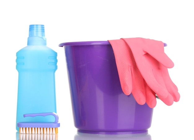 Detergent and bucket with gloves isolated on white