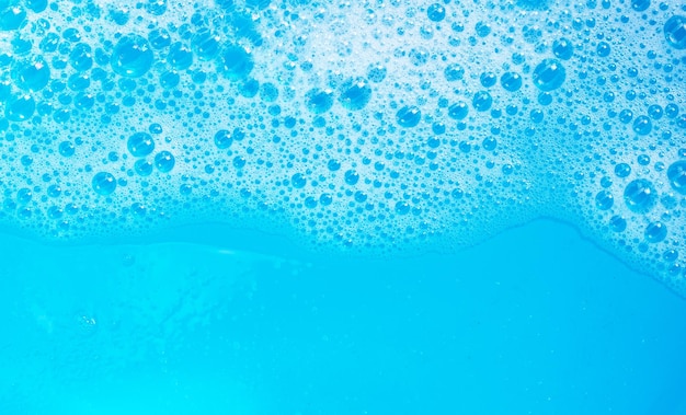 Detergent foam bubble on blue background