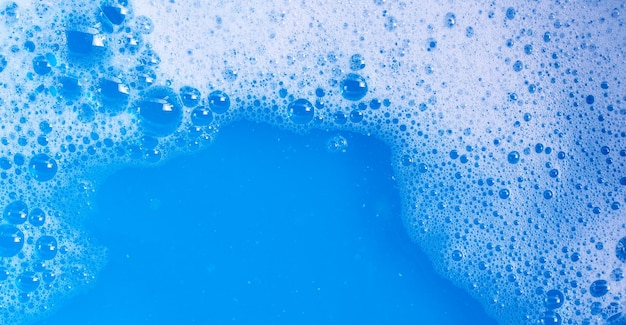 Detergent foam bubble on blue background