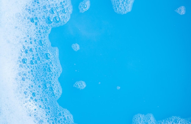 Detergent foam bubble blue background