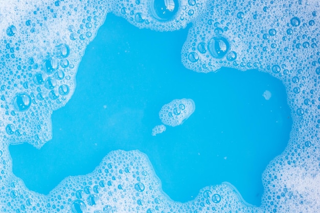 Detergent foam bubble blue background