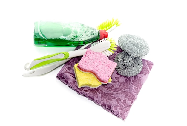 Detergent and washcloths on a white background