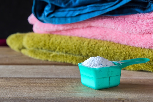 Detergent or washing powder in measuring spoon