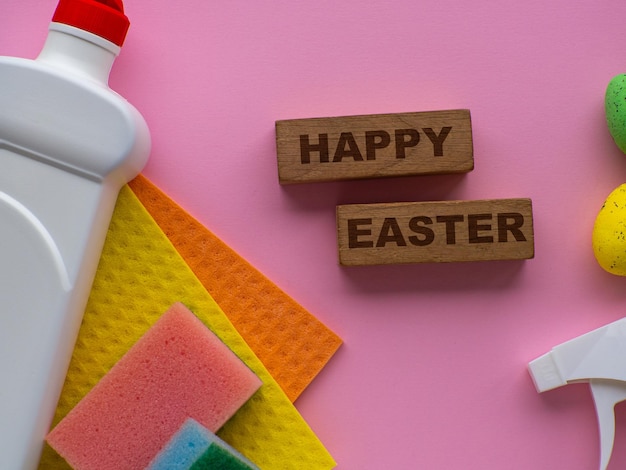 Detergent with Easter decoration on pink background with copy space