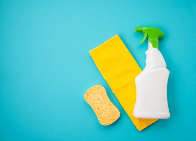 detergents and cleaning accessories in pastel color.