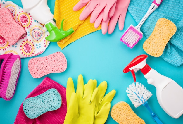 Detergents and cleaning accessories in pastel color.