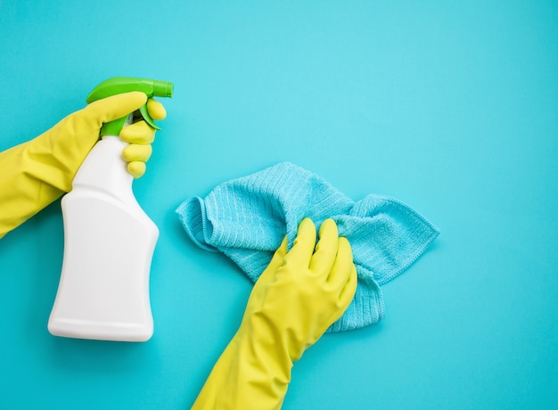 Detergents and cleaning accessories in pastel color.