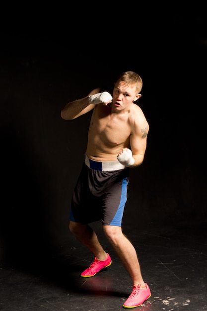 Determined boxer throwing a jab