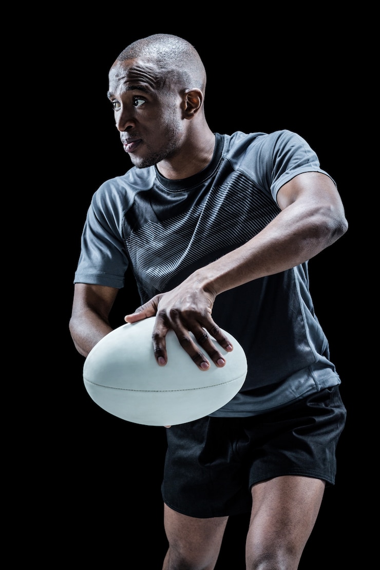 Photo determined rugby player in position to throw ball