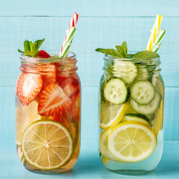 Detox fruit infused water. Refreshing summer homemade cocktail, selective focus.