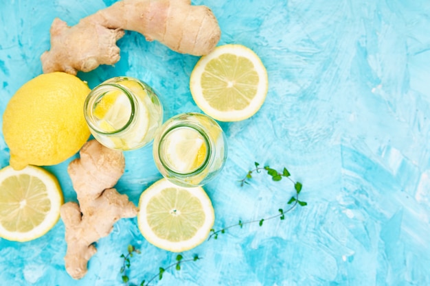 Detox water in bottles with ingredients, ginger, lemon, mint