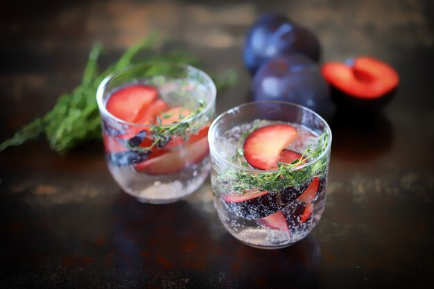 Detox water with plums and thyme