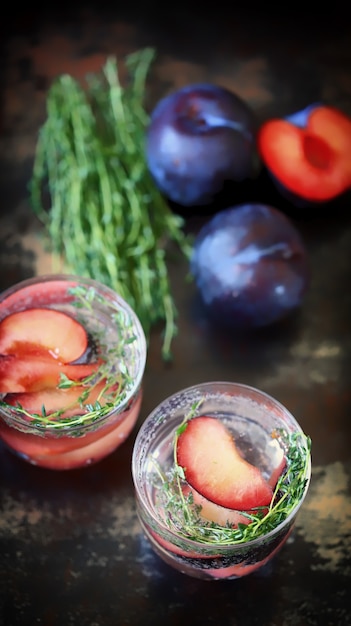 Detox water with plums and thyme