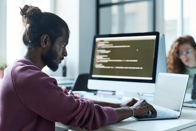 Developer concentrating on his online work