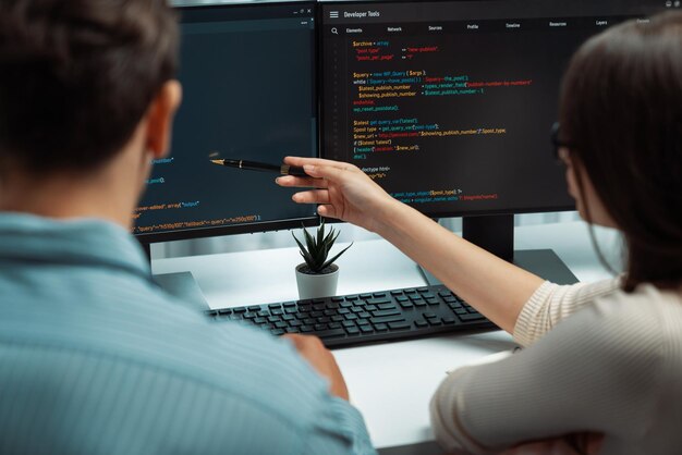 Premium Photo | Developers program coding discussing website planning ...
