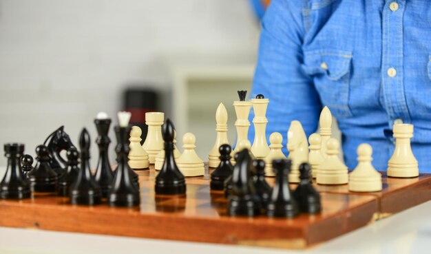 Photo development logics learning play chess bad move nullifies good ones chess lesson strategy concept playing chess intellectual hobby figures on wooden chess board thinking about next step