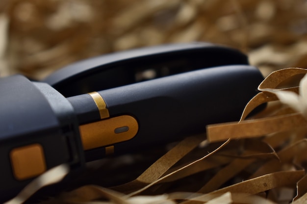 A device to heat tobacco. e-cigarette on a light background