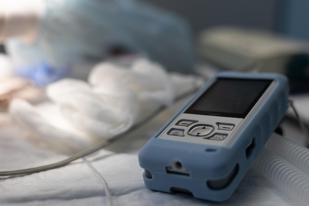 Photo the device lies on the table next to the pet and shows the indicators of heartbeat and oxygenation the device allows the anesthesiologist to monitor the vital signs of the pet during the operation