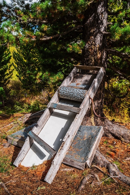 Device for peeling pine cones. Home-made device for folk craft. Altai Mountains, Russia