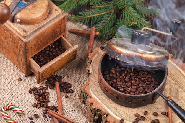 The device for roasting coffee beans, an old hand grinder.