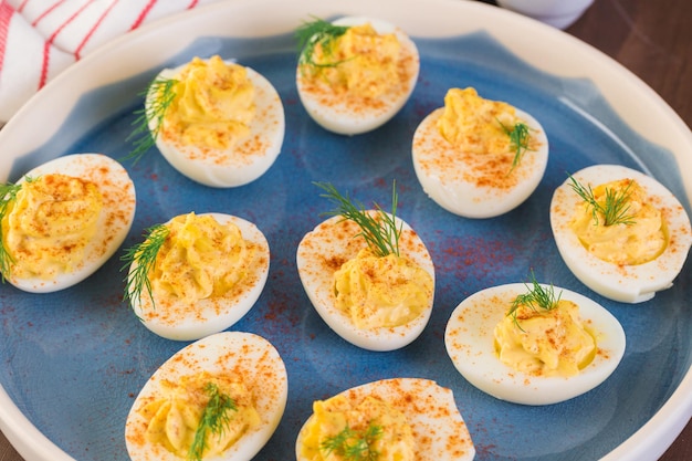 deviled eggs garnished with fresh dill.