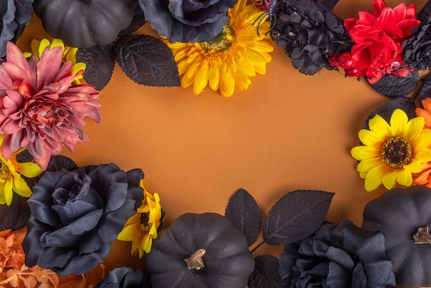 ディア・デ・ロス・ムエルトスの饗宴フラット横たわっていたメキシコ死者の日の休日の背景に秋の黒オレンジ黄色の花のライトボックスとテキストディア・デ・ロス・ムエルトスのカラフルな塗られた頭蓋骨