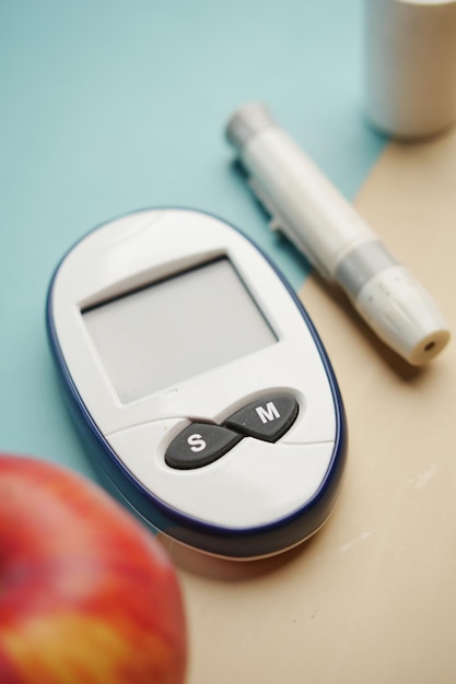 Diabetic measurement tools apple on table