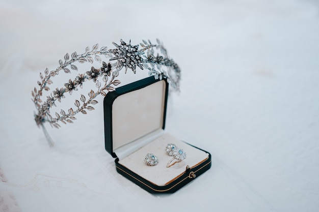 Diadem and earrings lent by a grandmother to the bride