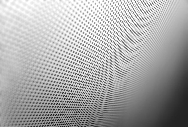 Diagonal carbon hole apertures texture background