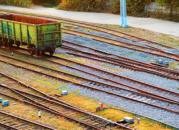 Diagonal empty railways with one car background