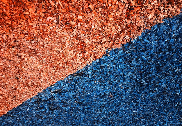 Diagonal orange and navy blue sawdust minimal texture background