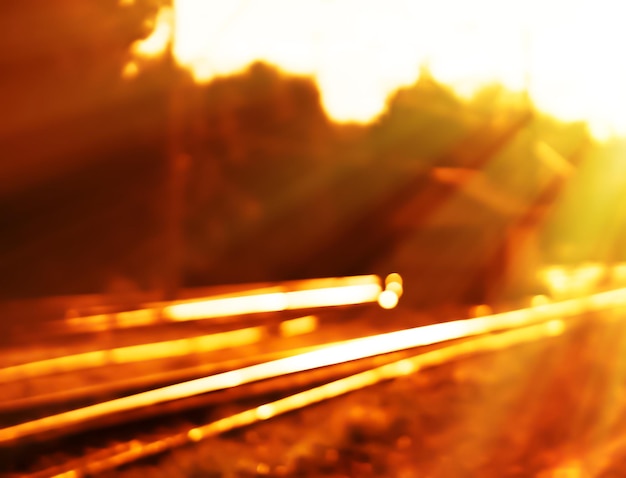 Фото Диагональ железной дороги закат боке свет утечка фон hd