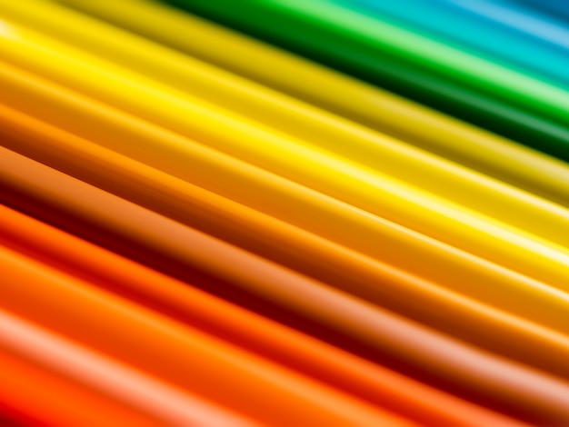 Diagonal row of colorful watercolor pencils. School supplies background.