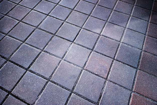 Diagonal tiles on street pavement background