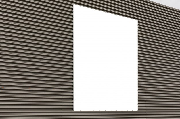 Diagonal view of corrugated metal gray wall with copyspace.