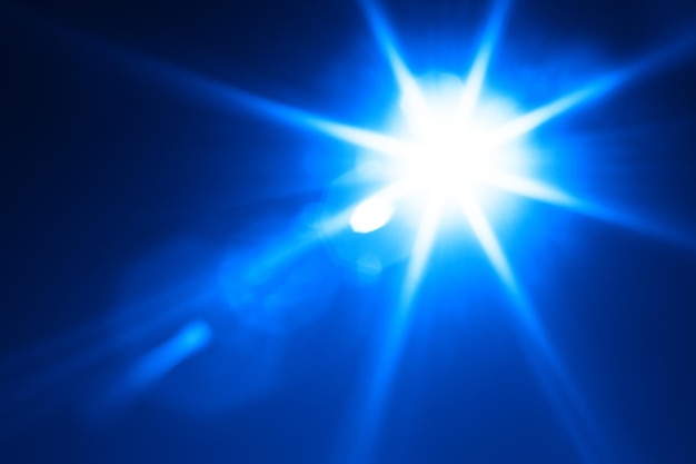 Diagonale blauwe gloeiende zon flare achtergrond hd