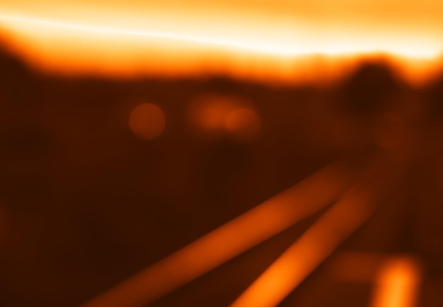 Foto diagonale zonsondergang spoorweg bokeh achtergrond hd