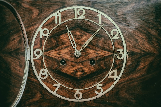 Photo dial of old wooden clock